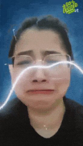 a woman wearing glasses is crying with the words so excited written on the bottom