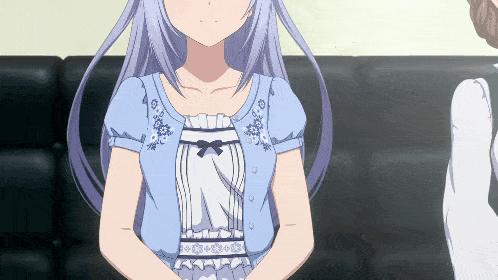 a girl with long gray hair is wearing a blue top