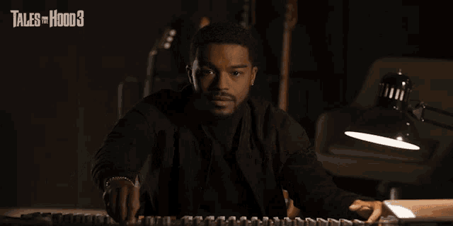a man playing a keyboard with tales of hood 3 on the bottom right