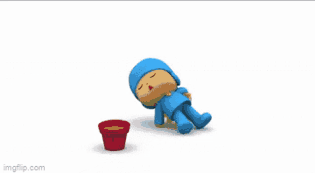 a cartoon character is laying on the ground next to a bowl of food
