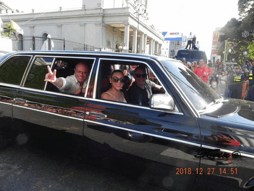 a photo of people in a limousine taken on december 27th 2018 at 14:51