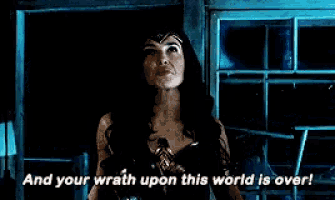 a woman in a wonder woman costume says and your wrath upon this world is over !