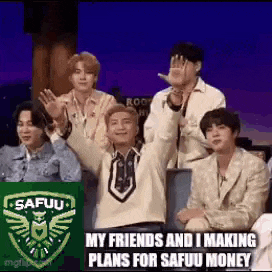 a group of men are sitting in a row with their hands in the air and making plans for safuu money .