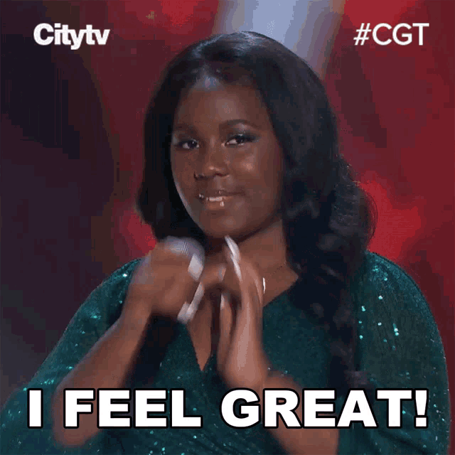 a woman singing into a microphone with the words " i feel great " above her