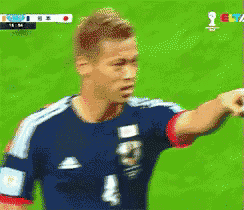 a soccer player with the number 4 on his jersey is pointing