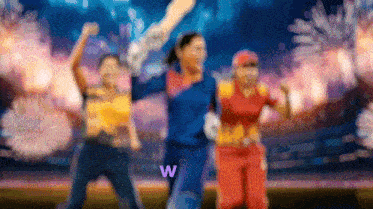 a blurry picture of a group of people with the letter w in the corner