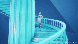 a woman in a white dress is walking up a spiral staircase