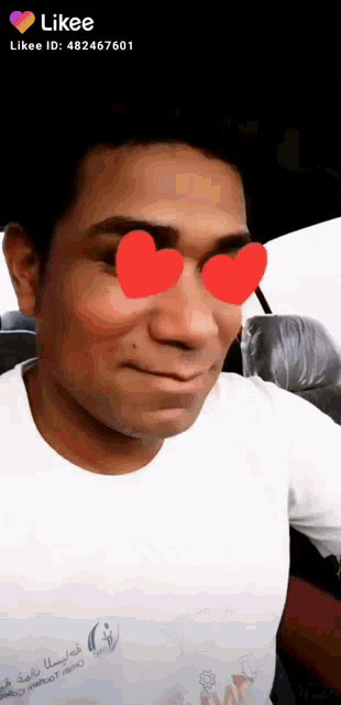 a man wearing a white shirt with the word likee on the bottom right