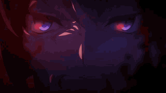 a close up of a person 's eyes with red and blue