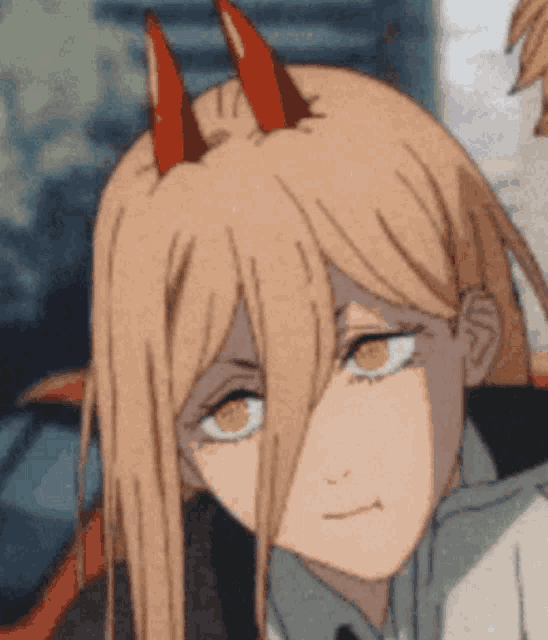a close up of a girl with long hair and horns .