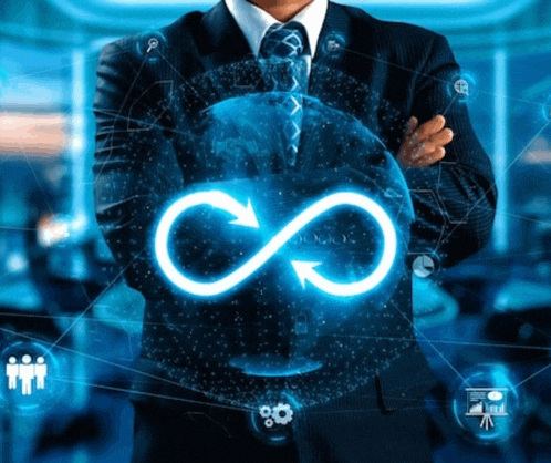 a man in a suit and tie holds an infinity symbol in his hands