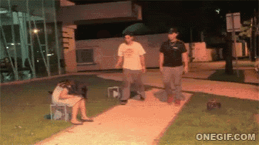 a gif of a woman sitting on a bench and two men walking down a sidewalk with onegif.com at the bottom