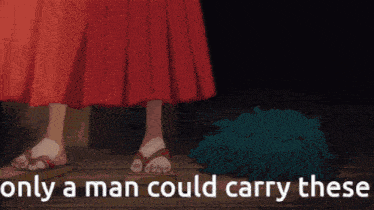 a man in a red skirt is standing next to a pile of green hair