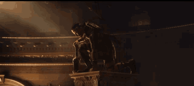 a man with a sword on his shoulder stands in a dark room