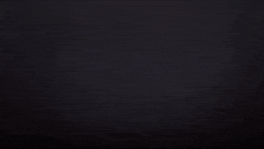a reflection of a city skyline in a body of water