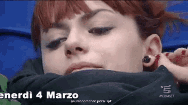a close up of a woman 's face with the date enerdi 4 marzo