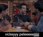 a group of men are sitting at a table talking to each other and the caption says vickeyyy peleeeee