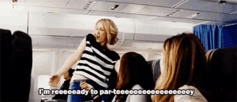 a woman on an airplane says i 'm reeeeeady to par-teeee