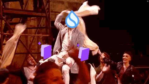 a man is being lifted in the air by a woman with a water drop on his face .