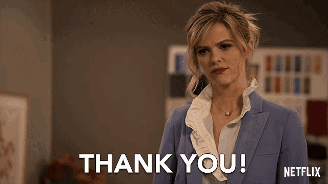 a woman in a blue suit says thank you in a netflix ad