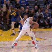 a basketball player with the number 2 on his jersey is playing defense on another player .