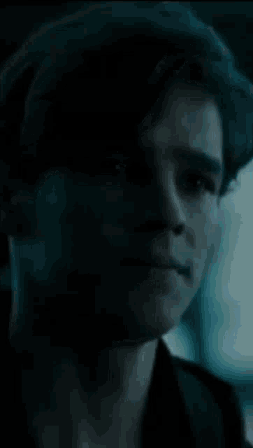 a close up of a man 's face with a blurred background