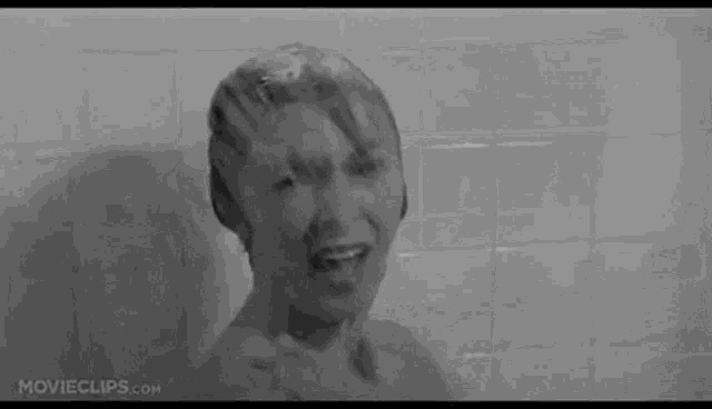 a close up of a person 's mouth with water dripping out of it .
