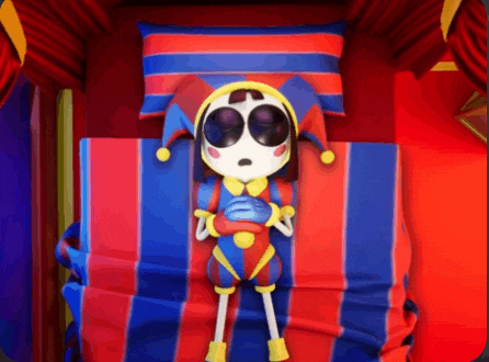 a jester doll is laying on a bed