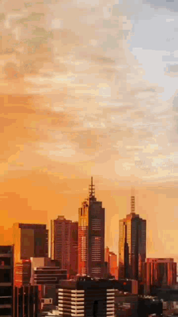 a painting of a city skyline at sunset with a cloudy sky