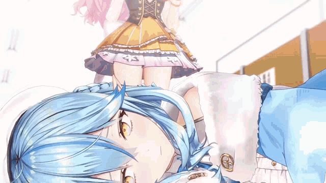 a girl with blue hair is laying down and a girl with pink hair is standing behind her