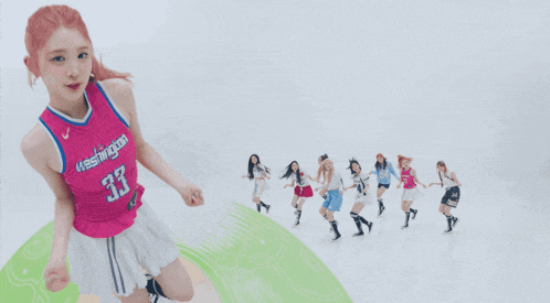 a girl in a washington 33 jersey is dancing with other girls