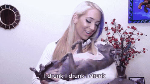 a woman holding a dog with the words " i drunk i drunk i drunk " on the bottom