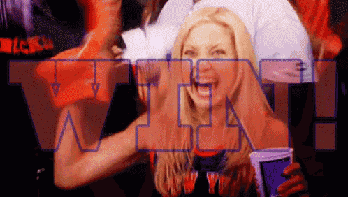 a woman is holding a cup in front of a win sign