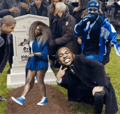a woman in a blue dress is standing in front of a grave that says 1986