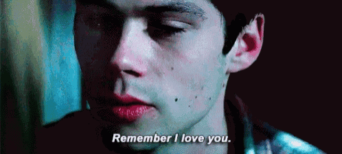 a close up of a man 's face with a red lip and the words `` remember i love you '' .