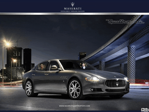 a maserati car is displayed on a poster with a city in the background