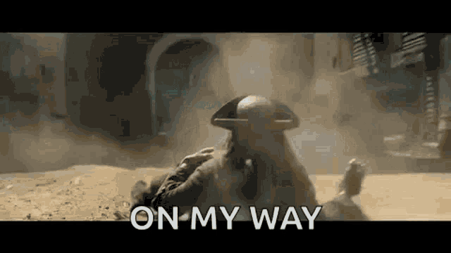 a man in a pirate hat is laying on the ground with the words `` on my way '' .