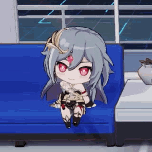 a chibi girl is sitting on a blue couch in front of a window .