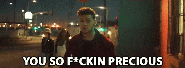 a man walking down a street with the words " you so f * ck in precious " below him