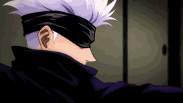 a close up of a person wearing a bandana and a purple jacket .