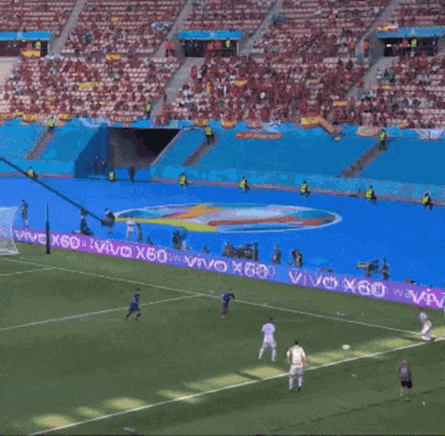 a soccer game is being played in a stadium with volkswagen way to zero banners