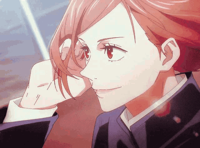 a close up of a girl 's face with red hair and red eyes