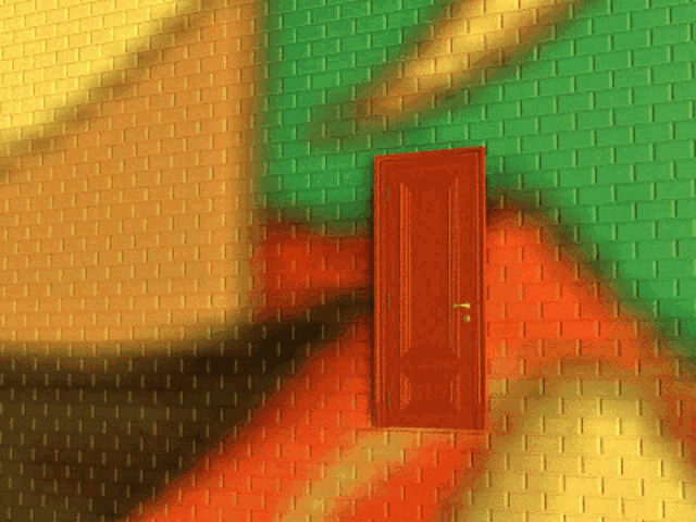 a red door is against a green and yellow wall