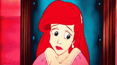 a cartoon of ariel from the little mermaid looking at a picture .