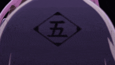 the back of a person 's shirt has a chinese symbol on it