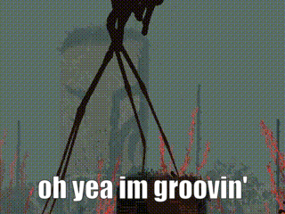 a silhouette of a monster with the words oh yea im groovin ' on it .