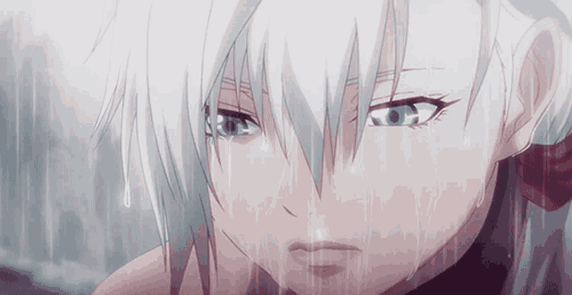 a girl with white hair and blue eyes is crying