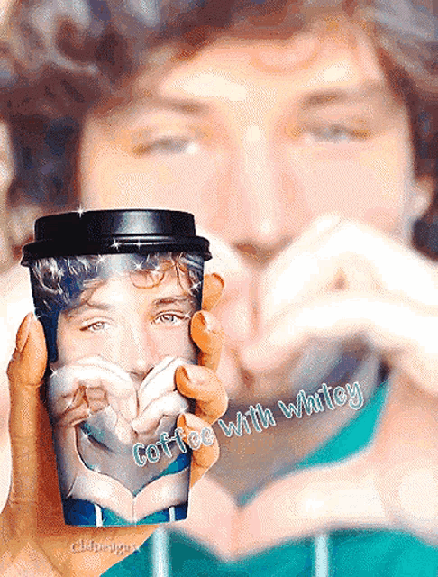 a man is holding a cup of coffee that says coffee with whitney