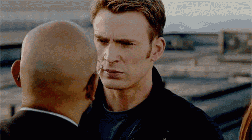 a bald man is looking at a bald man 's face