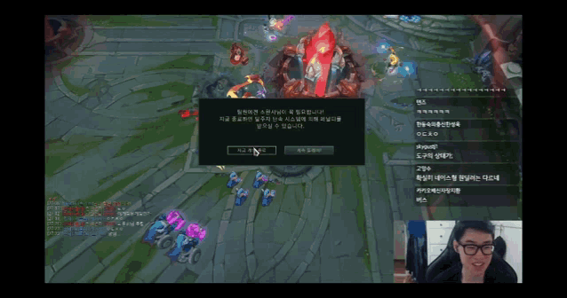 a man in glasses is playing a video game with foreign text